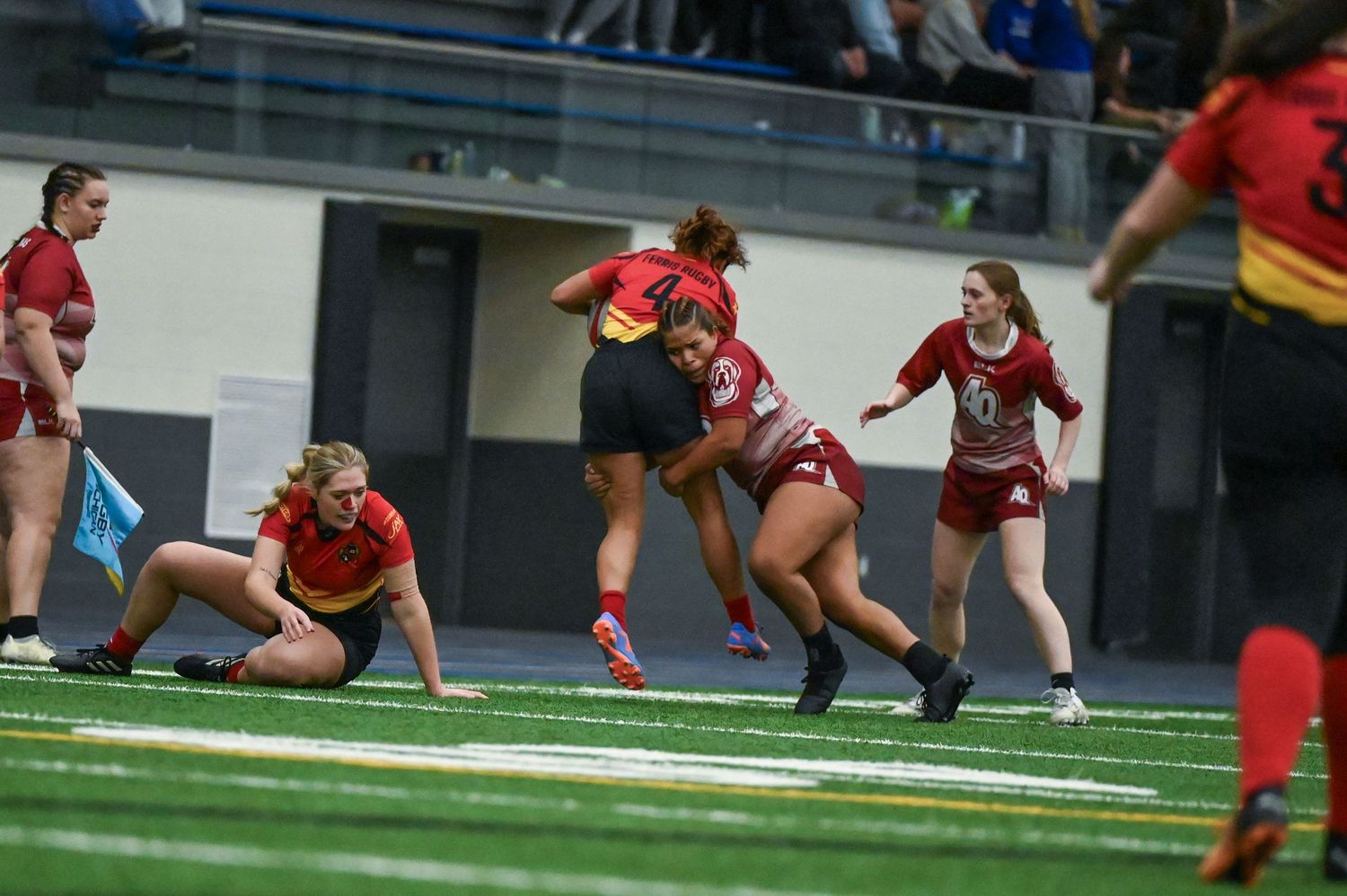 Aquinas Women's Rugby making a tackle, Aquinas vs Ferris State, Kelley Family Sports Center, Allendale MI, 2/22/25