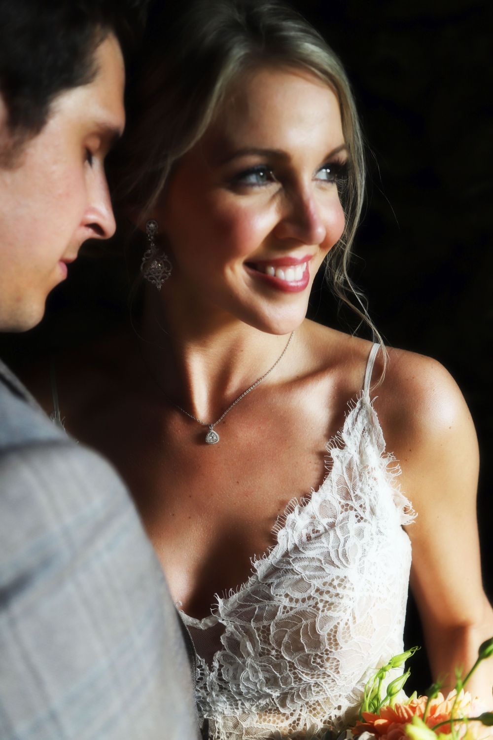 Intimate wedding portrait captures romantic moment in elegant attire.