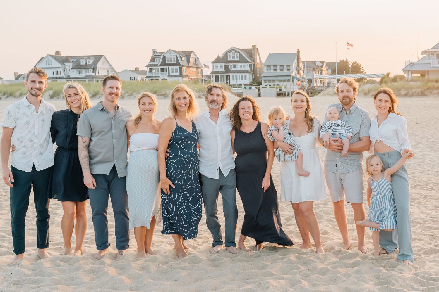 A portrait of an extended family photo session with 10 adults and three children in sea girt nj.