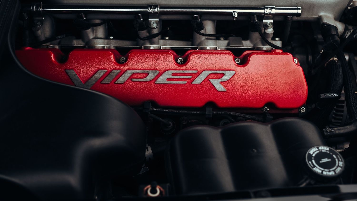 Engine bay detail showing red Viper engine components.