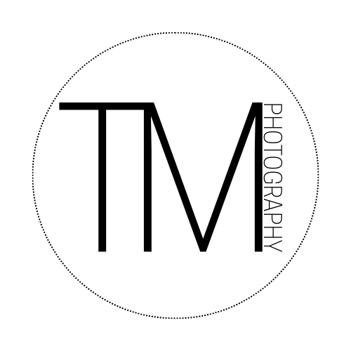A perfectly circular black loading or buffering icon with a small white dot in the center appears against a dark background.