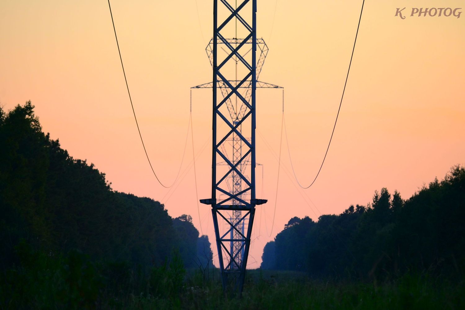 A view of a utility highline looking into the sunset
