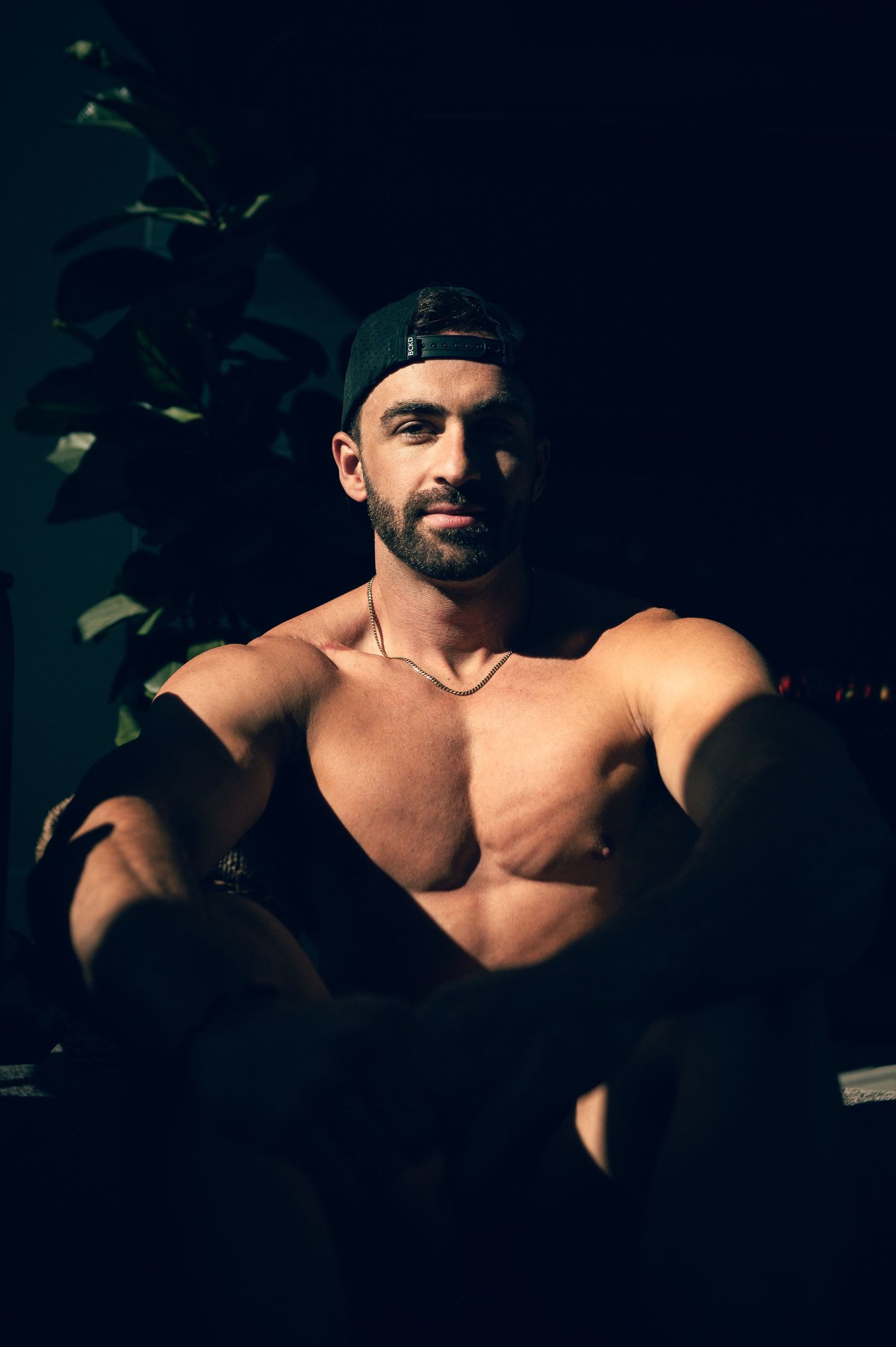 LGBTQ friendly photographer in Salt Lake City Utah creating confidence-driven fitness portraits. Male Portrait in studio by Carl James