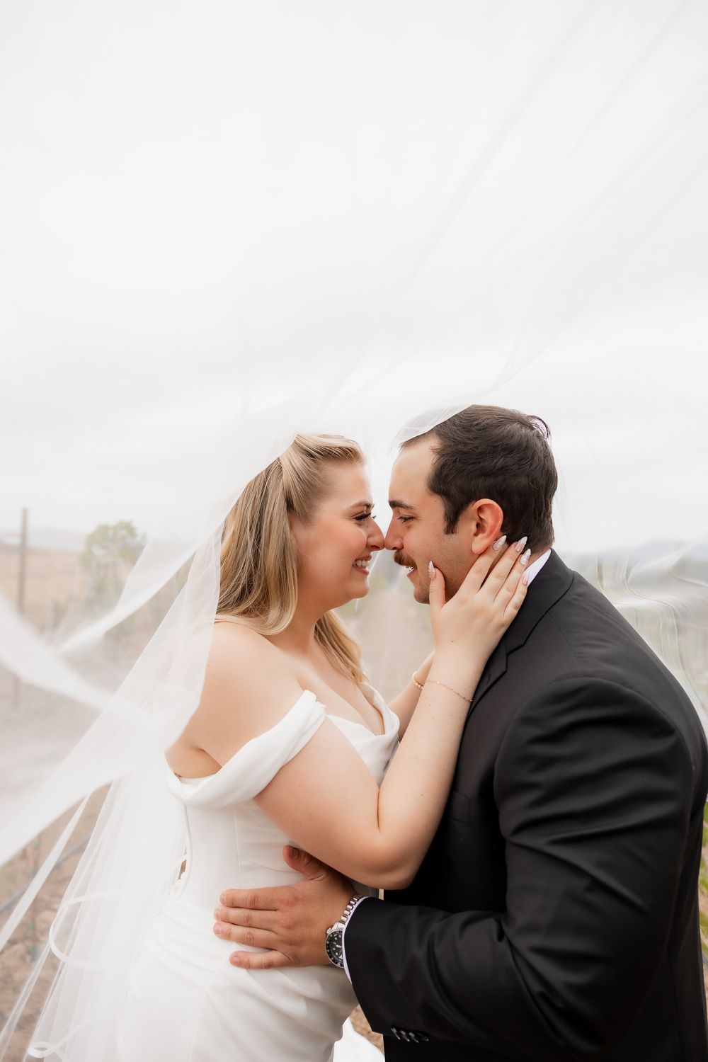 Romantic wedding photography sequence showing tender moments between newlyweds with flowing veil.