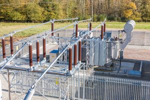 Site engineer in full PPE working on an ABB grid connection at a renewable energy facility -10