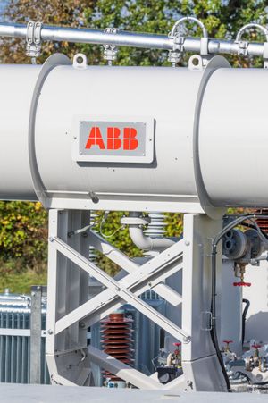 Site engineer in full PPE working on an ABB grid connection at a renewable energy facility -11