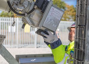 Site engineer in full PPE working on an ABB grid connection at a renewable energy facility -12