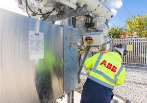 Site engineer in full PPE working on an ABB grid connection at a renewable energy facility -13