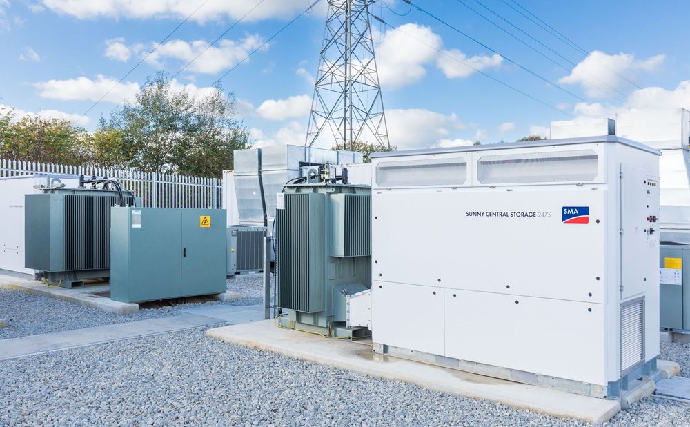 Site engineer in full PPE working on an ABB grid connection at a renewable energy facility -1