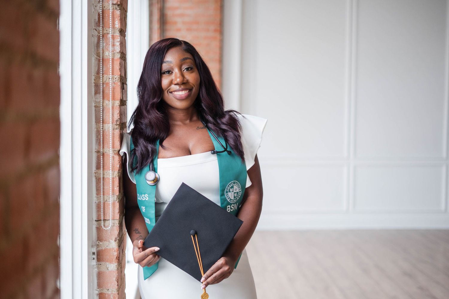 Dallas- Fort Worth Graduation Photographer graduate holding cap
