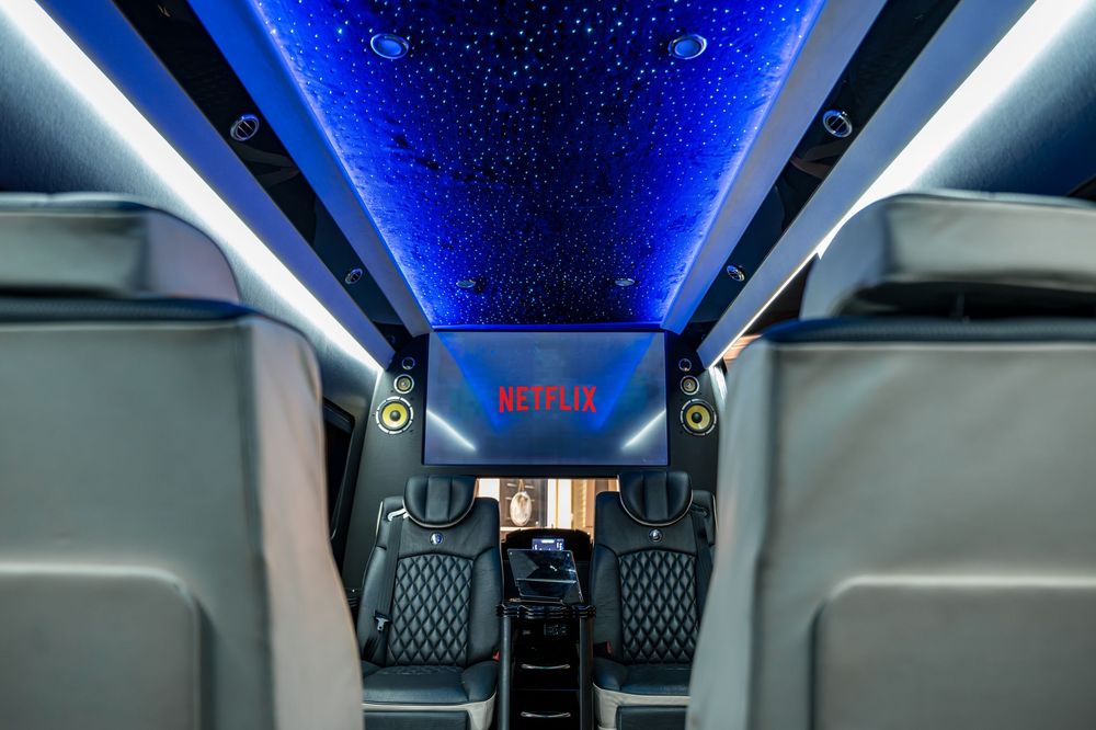 Shot of the luxurious seating and TV in the Ski Lift Limo by Denver Hospitality, Travel & Tourism photographer Captain Colorado Photography.