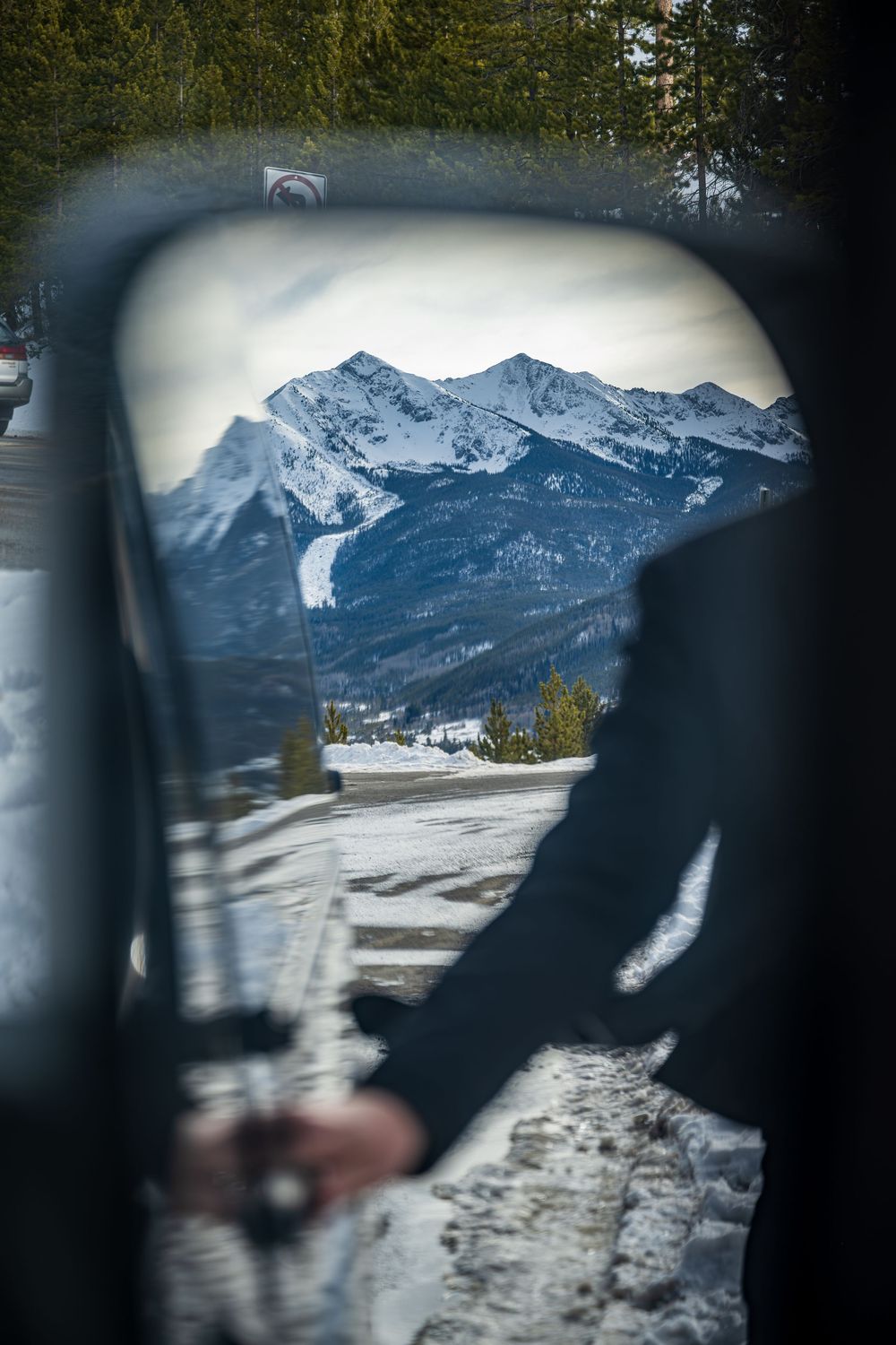 Shot of the driver opening the door of the Ski Lift Limo by Denver Hospitality, Travel & Tourism photographer Captain Colorado Photography.