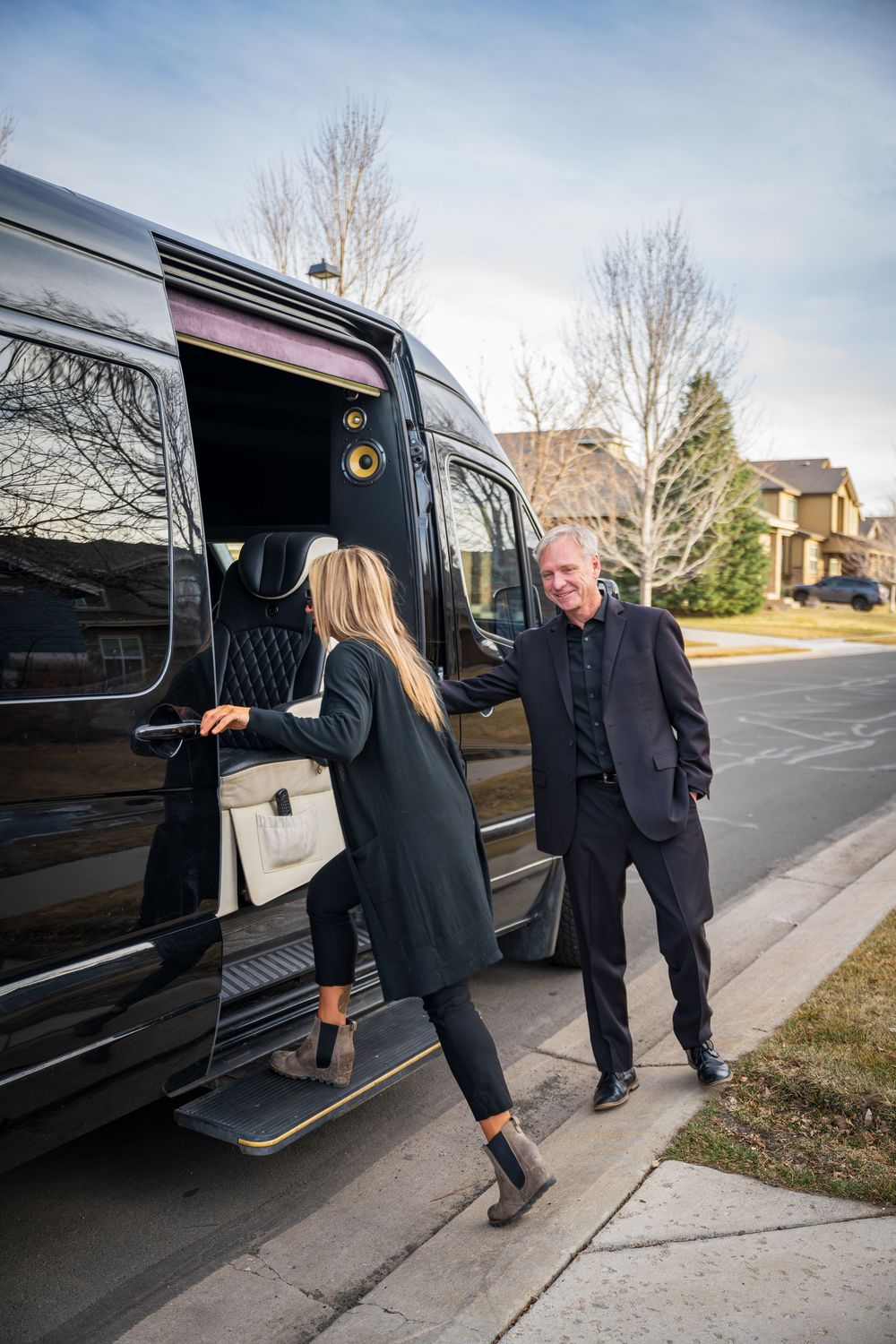Shot of a passenger entering the Ski Lift Limo by Denver Hospitality, Travel & Tourism photographer Captain Colorado Photography.
