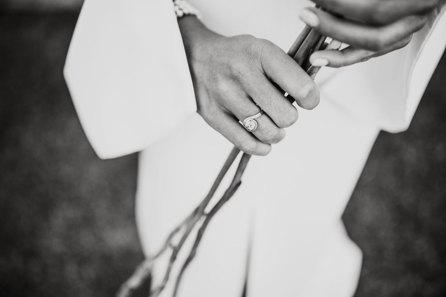 Detail shot of white wedding dress fabric and delicate lace.