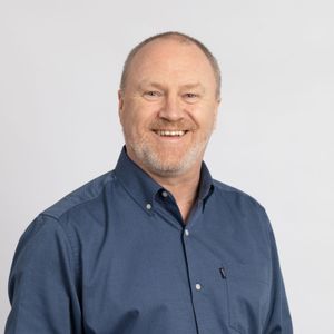Professional studio headshot on plain background-16