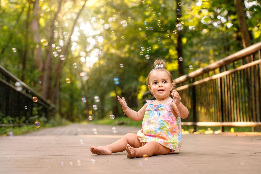 Bergen County Photoshoot locations for family photography baby with bubbles on bridge