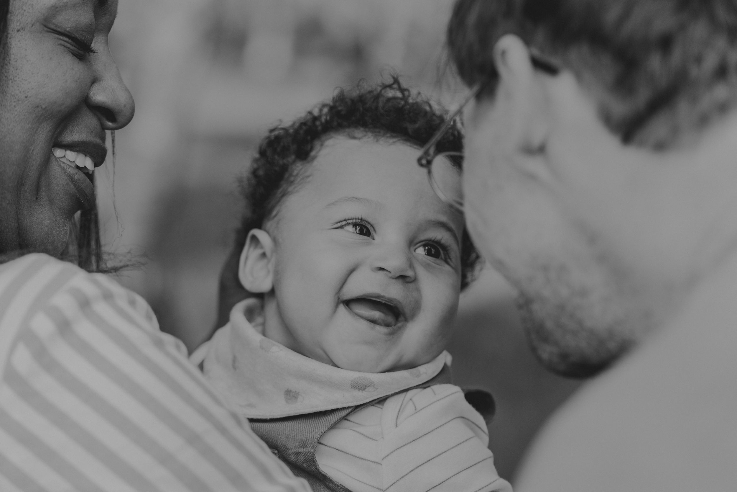 Close up of a heartwarming family interaction in black and white.