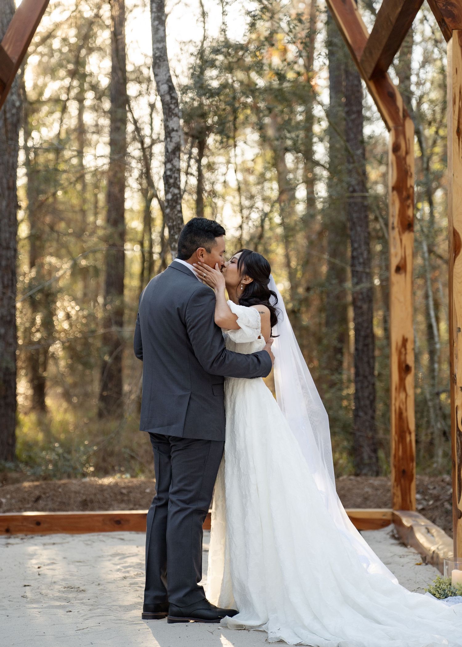 Twilight elopement ceremony of the Barrillas Family in Montgomery TX, with warm, moody light