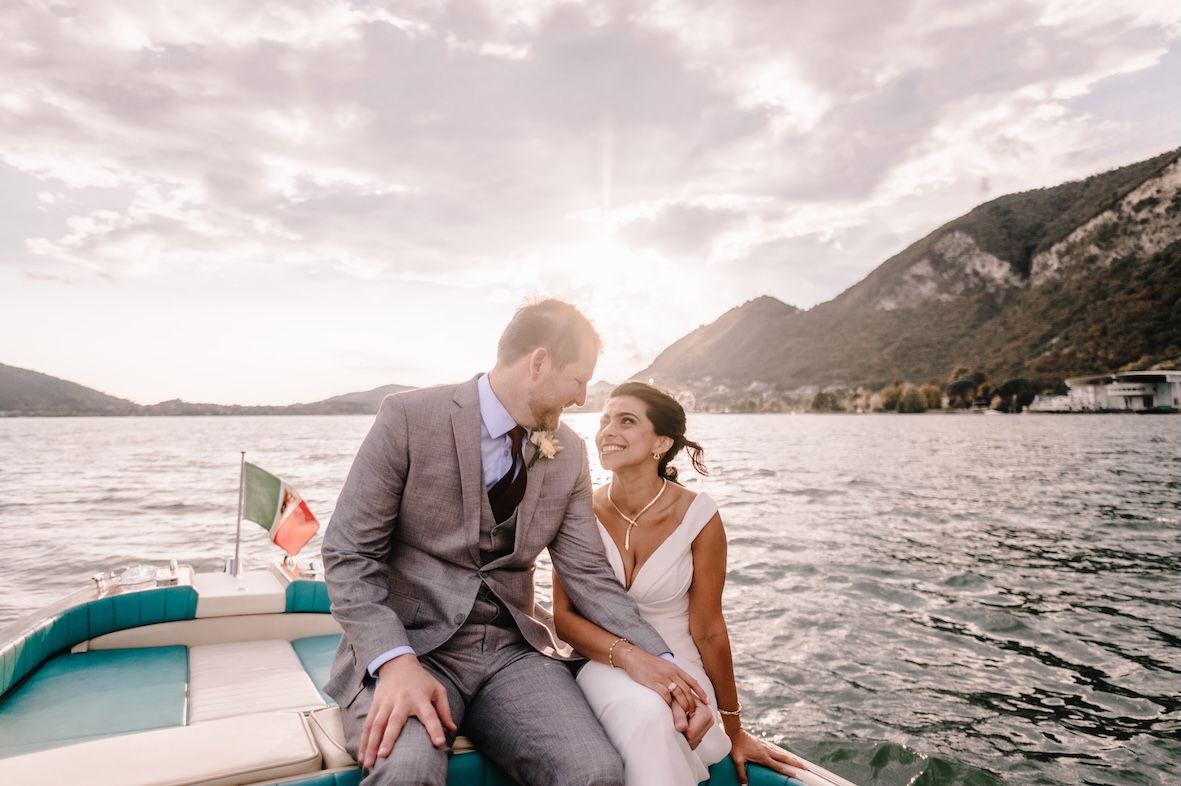 Bride and groom wedding photoshoot on a Riva boat at Lake Iseo