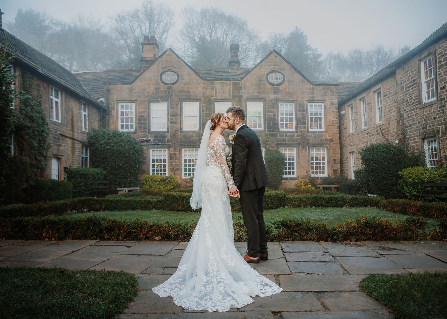 Couple sharing a kiss outside Whitley Hall - Sheffield