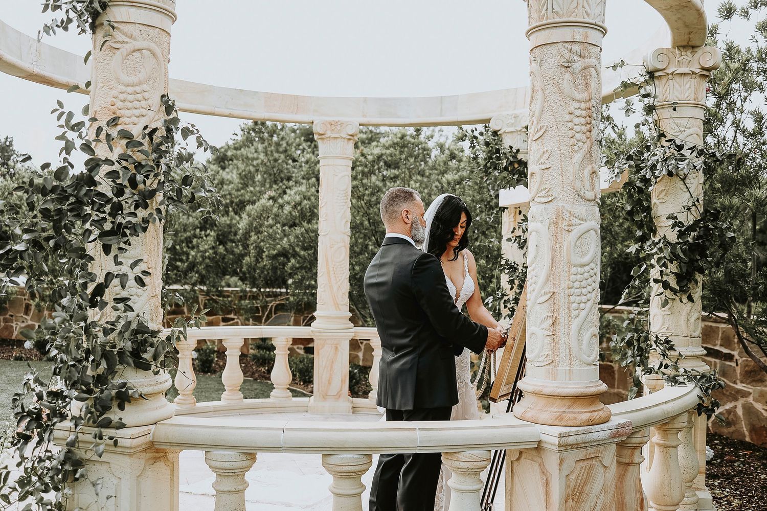 Christian wedding ceremony moment at vineyard venue