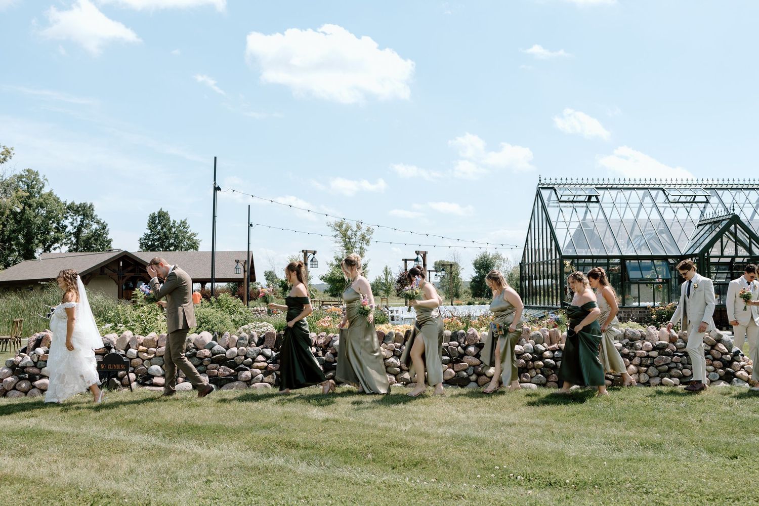 Civil War reenactors demonstrate battle tactics and military formations in a grassy field during a historical event.
