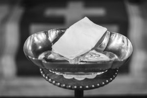 A series of black and white photos showing plates and dishes arranged in a horizontal row.
