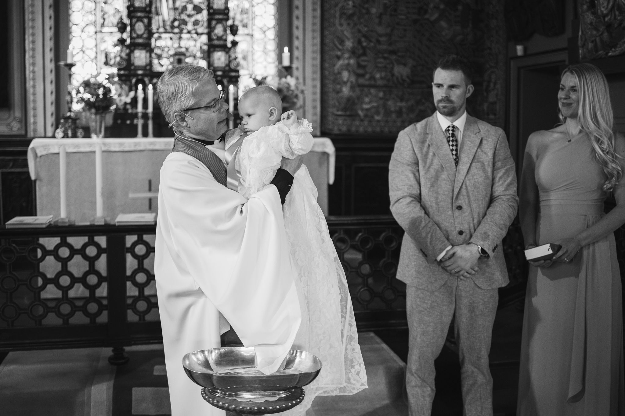A black and white photo montage showing multiple wedding scenes with couples and guests at a formal celebration.