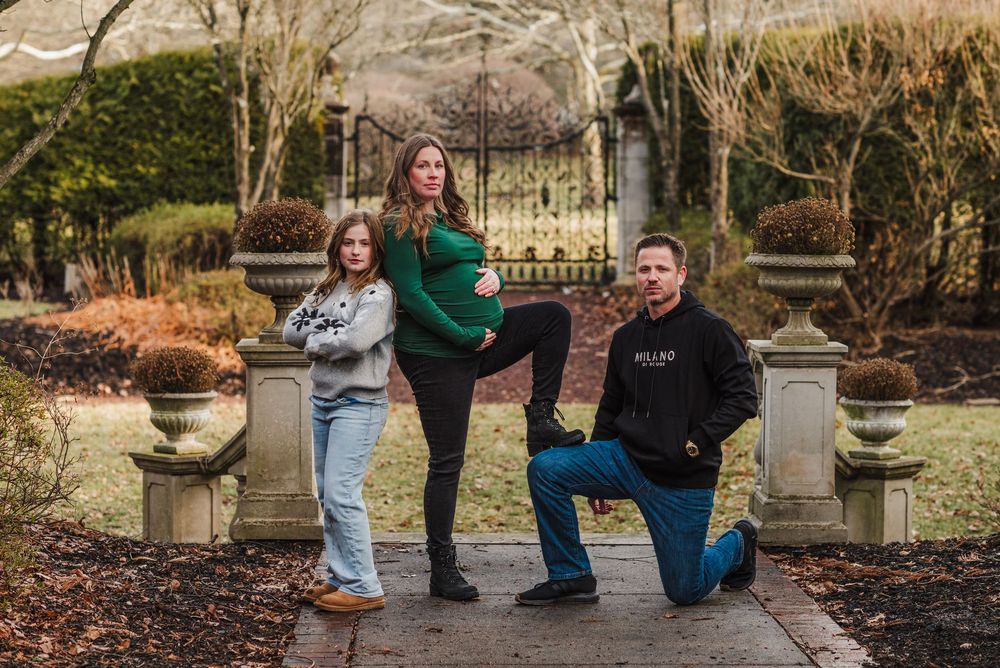 A sequence of outdoor family pregnancy announcement photos with people posing in a garden setting.