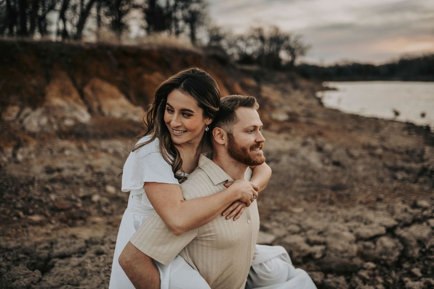 a couple embraces on the lake at sunset in corinth texas