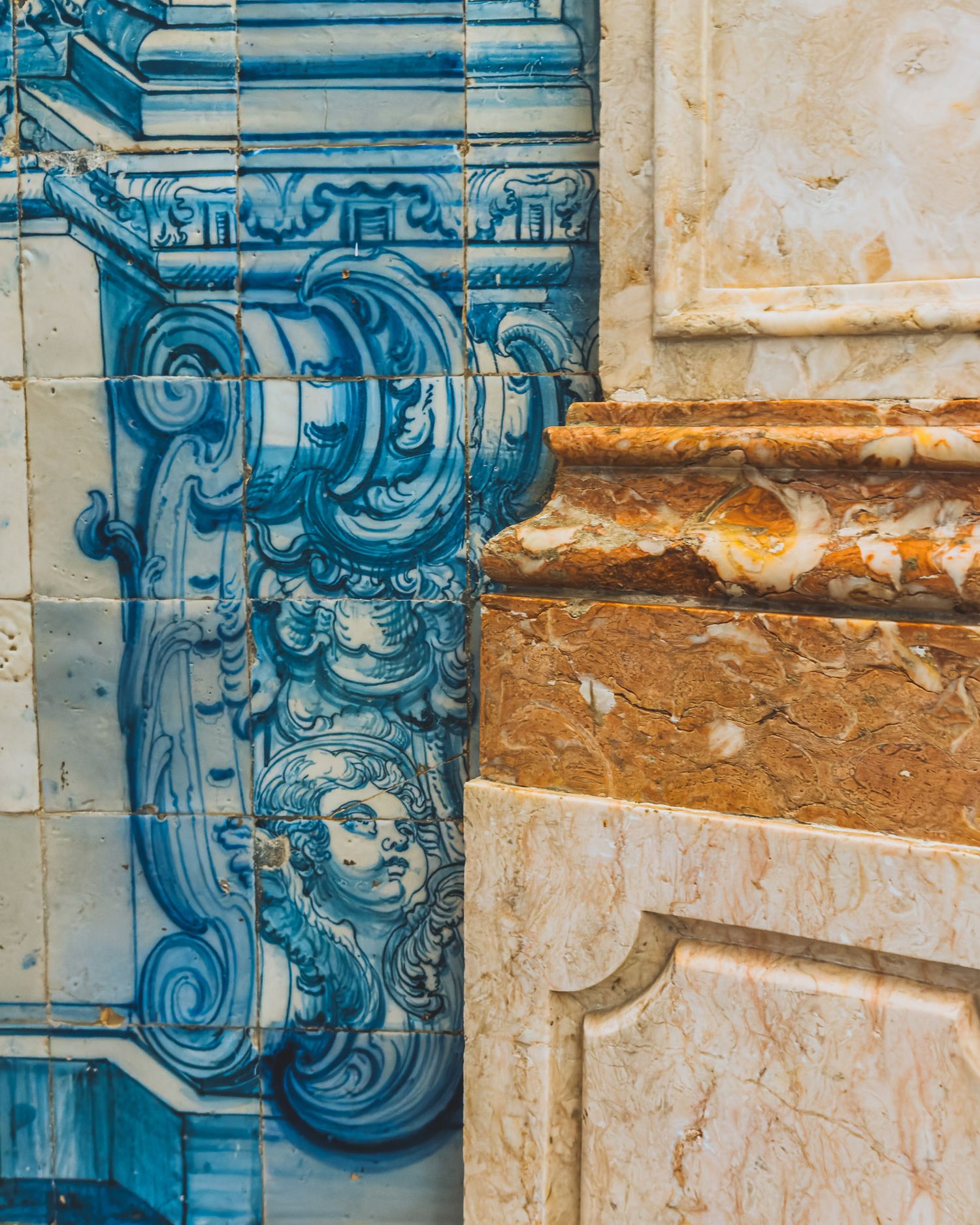 Detailed blue Portuguese azulejo tile work with ornate baroque patterns and designs.