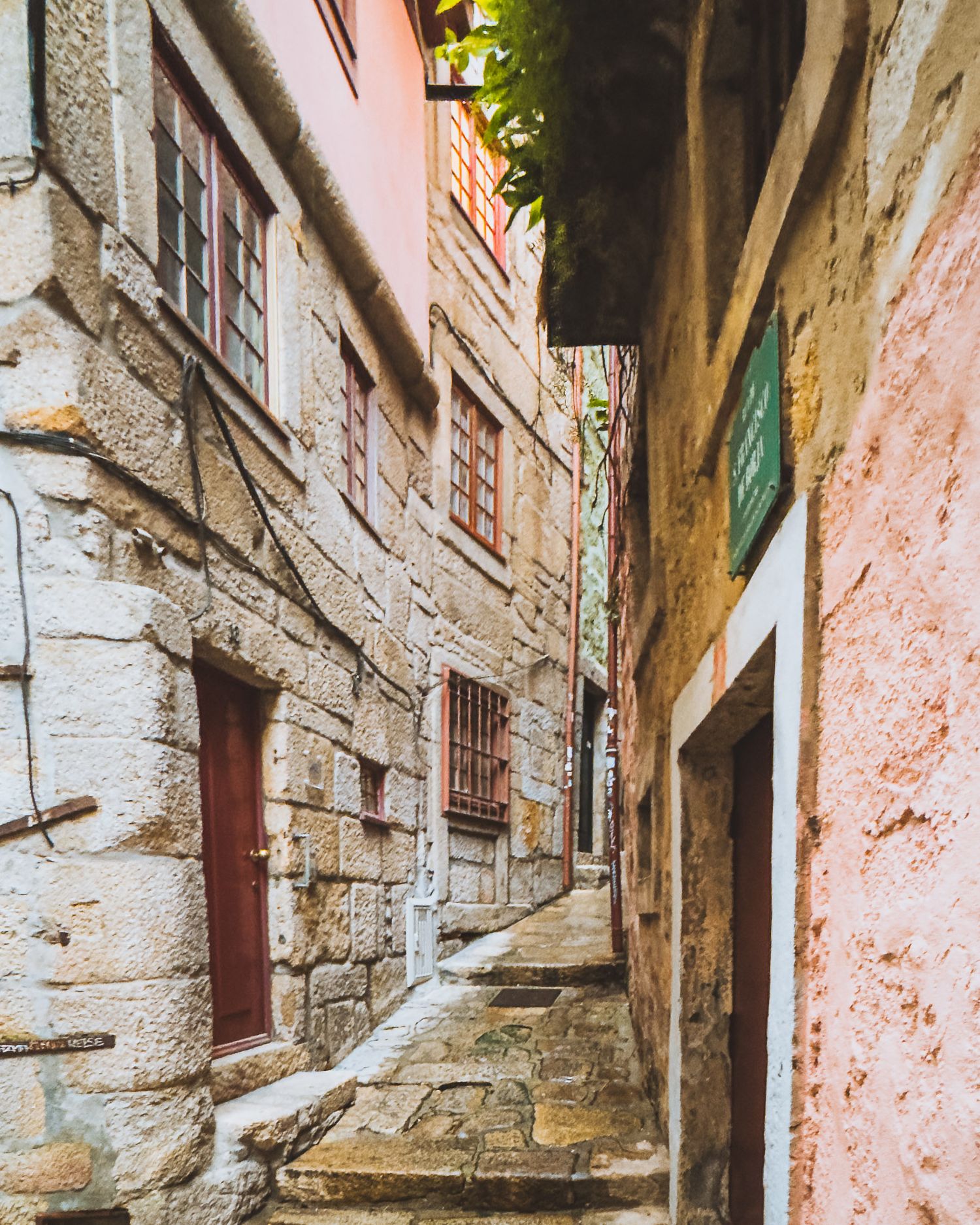Ancient stone corridor with weathered walls and traditional architectural details.