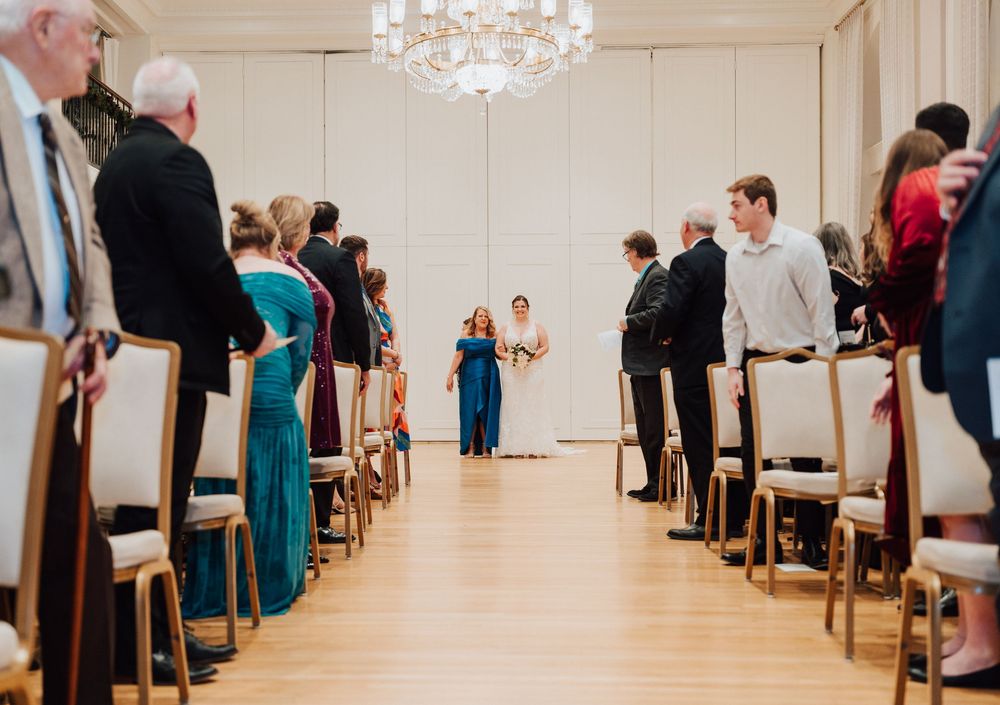 Yorktowne Hotel wedding in York, PA– bride making entrance to wedding ceremony in east ballroom – elegant winter wedding
