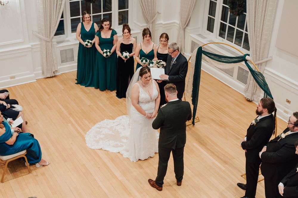 Yorktowne Hotel wedding in York, PA – bride and groom exchange vows during wedding ceremony in ballroom – elegant winter wedding