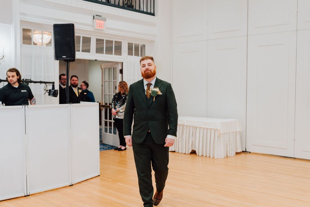 Yorktowne Hotel wedding in York, PA– groom walking to wedding ceremony  – elegant winter wedding