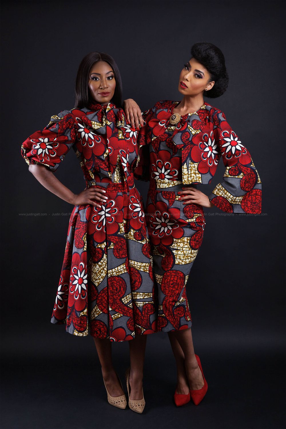 Models showcase matching red floral print dresses in a studio setting.