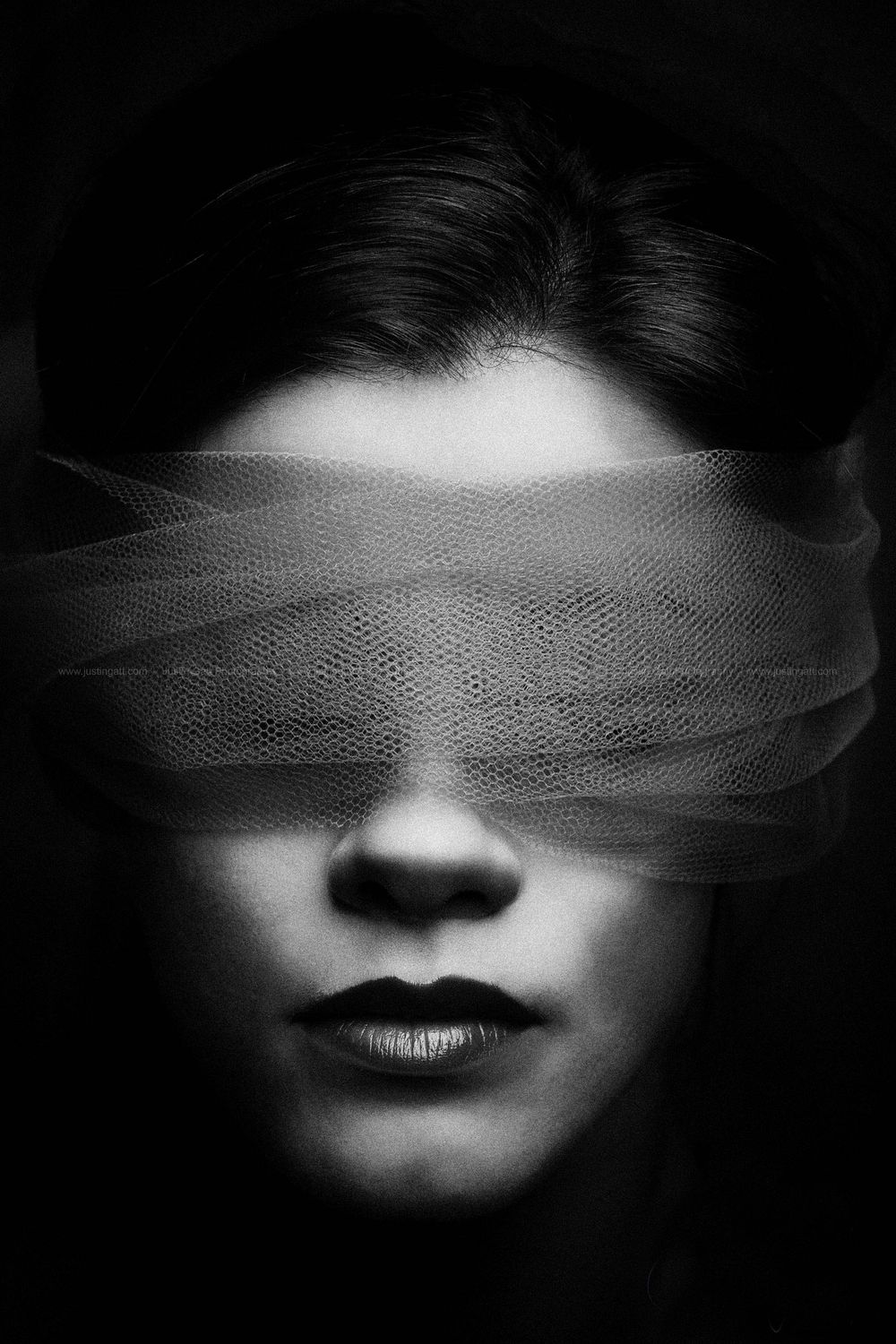 Dramatic black and white portrait series showing a face partially covered with gauze material.