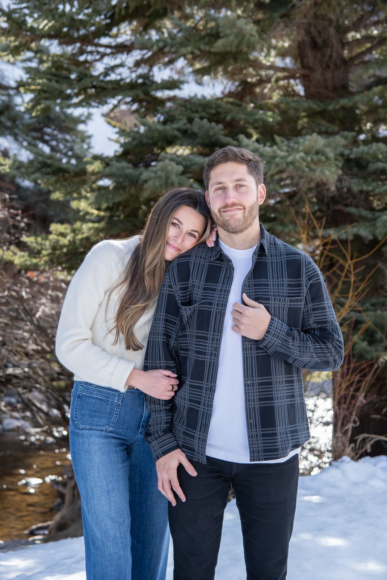 Fashion couple for winter engagement photos in Vail Colorado after a surprise proposal