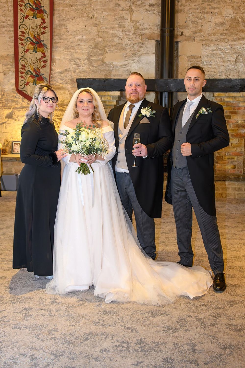 Bride, groom, bridesmaid and her husband at voco Oxford Thames wedding celebration