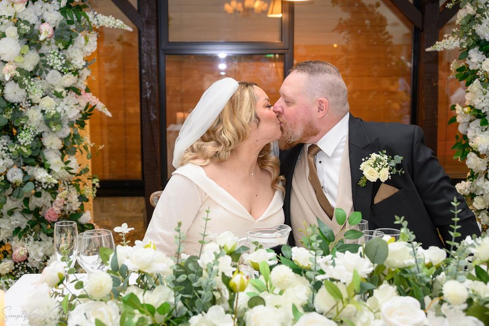 Bride and groom sharing a kiss at voco Oxford Thames historic wedding venue