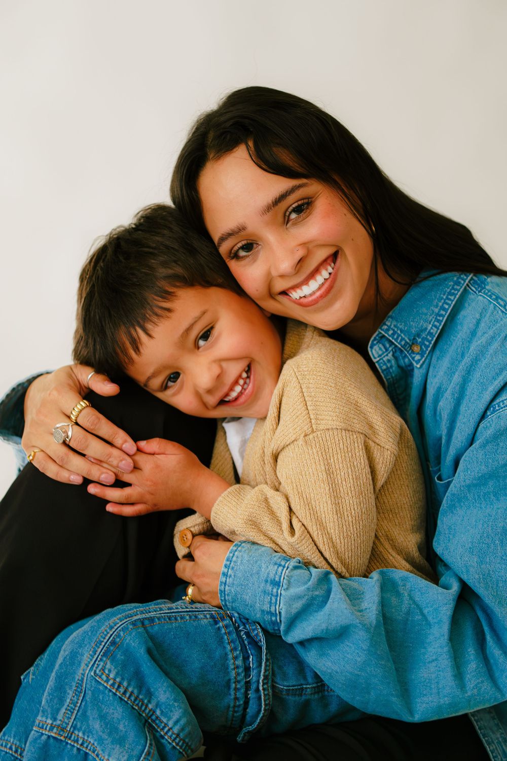 A heartwarming series of candid moments showing playful interaction and laughter between two people in denim and beige.