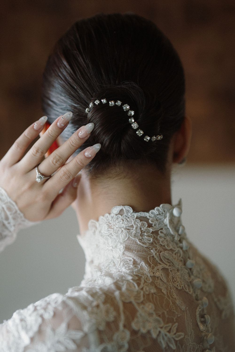 Delicate lace details and hair accessories shown in close-up wedding preparation shots.