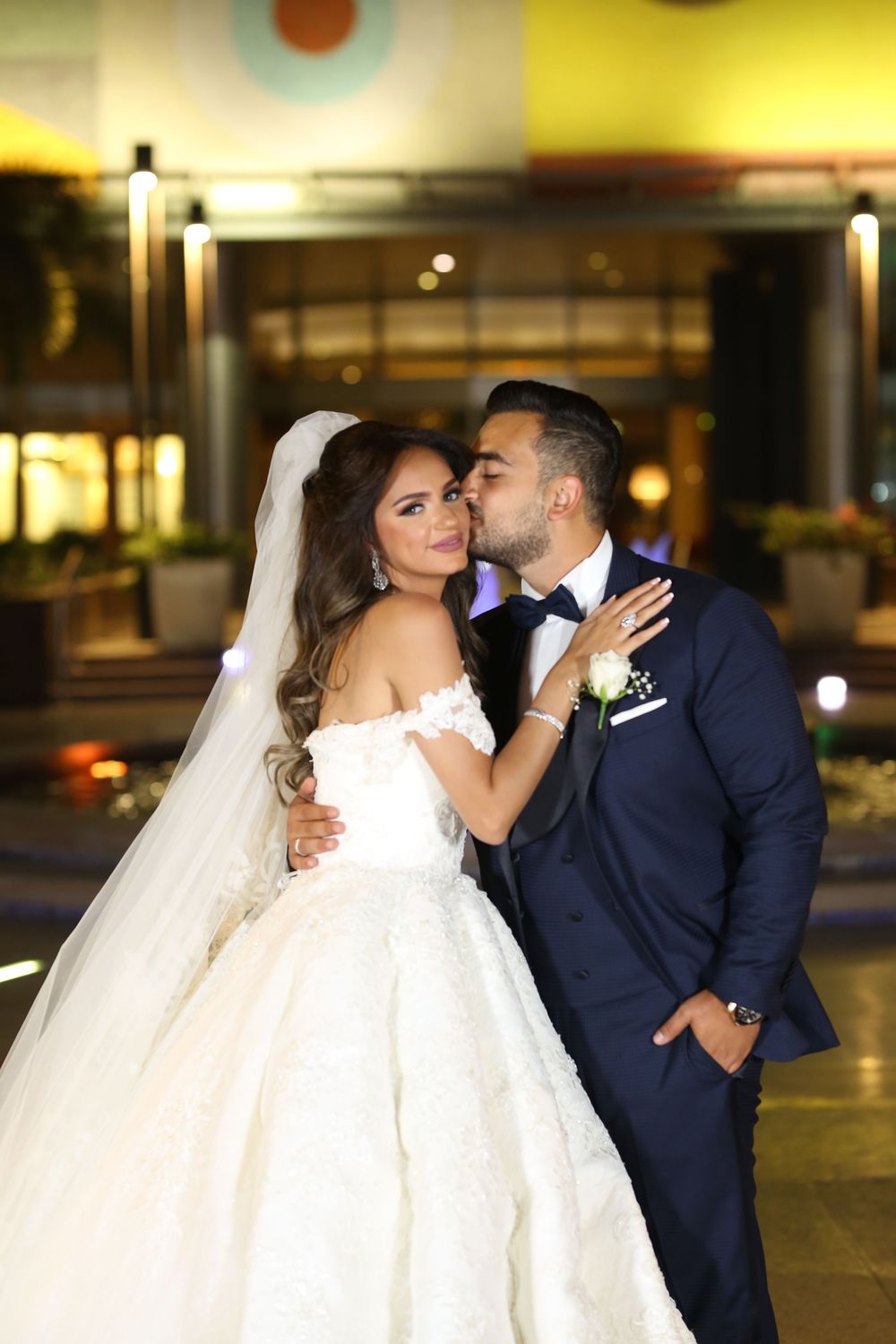 Evening wedding portraits showing tender moments between newlyweds.