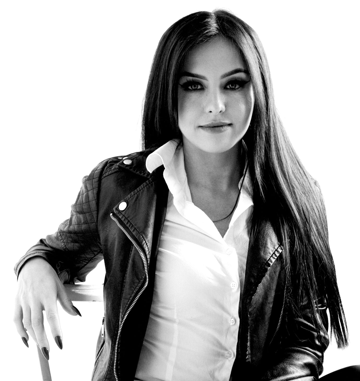Modern young lady in a leather jacket looking confident