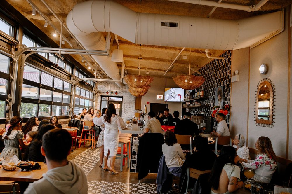 A panoramic collage showing various angles of a casual dining restaurant interior with tables, chairs and patrons.