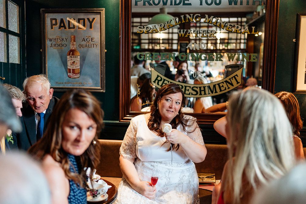 A joyful wedding event sequence shows couples and guests celebrating at a reception in a warm, rustic venue.