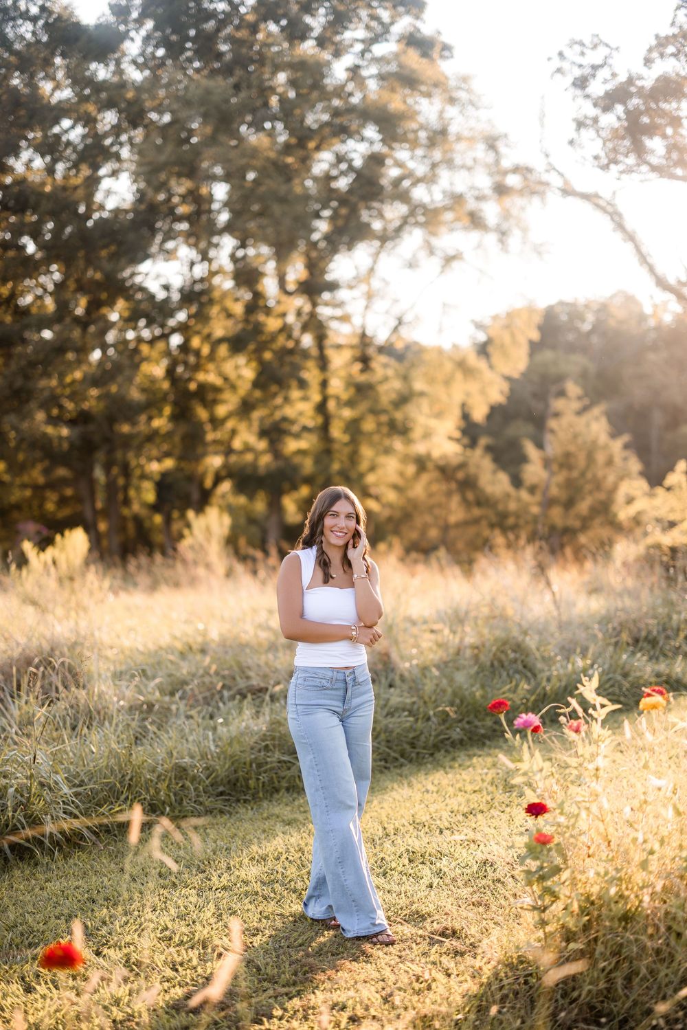A relaxing summer scene of someone wandering through a meadow filled with red poppies and wild grasses.
