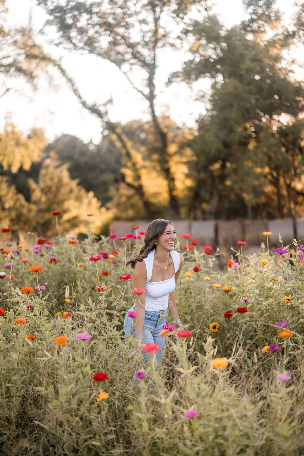 A dreamy scene in a vibrant wildflower field filled with colorful poppies and blooms at golden hour.