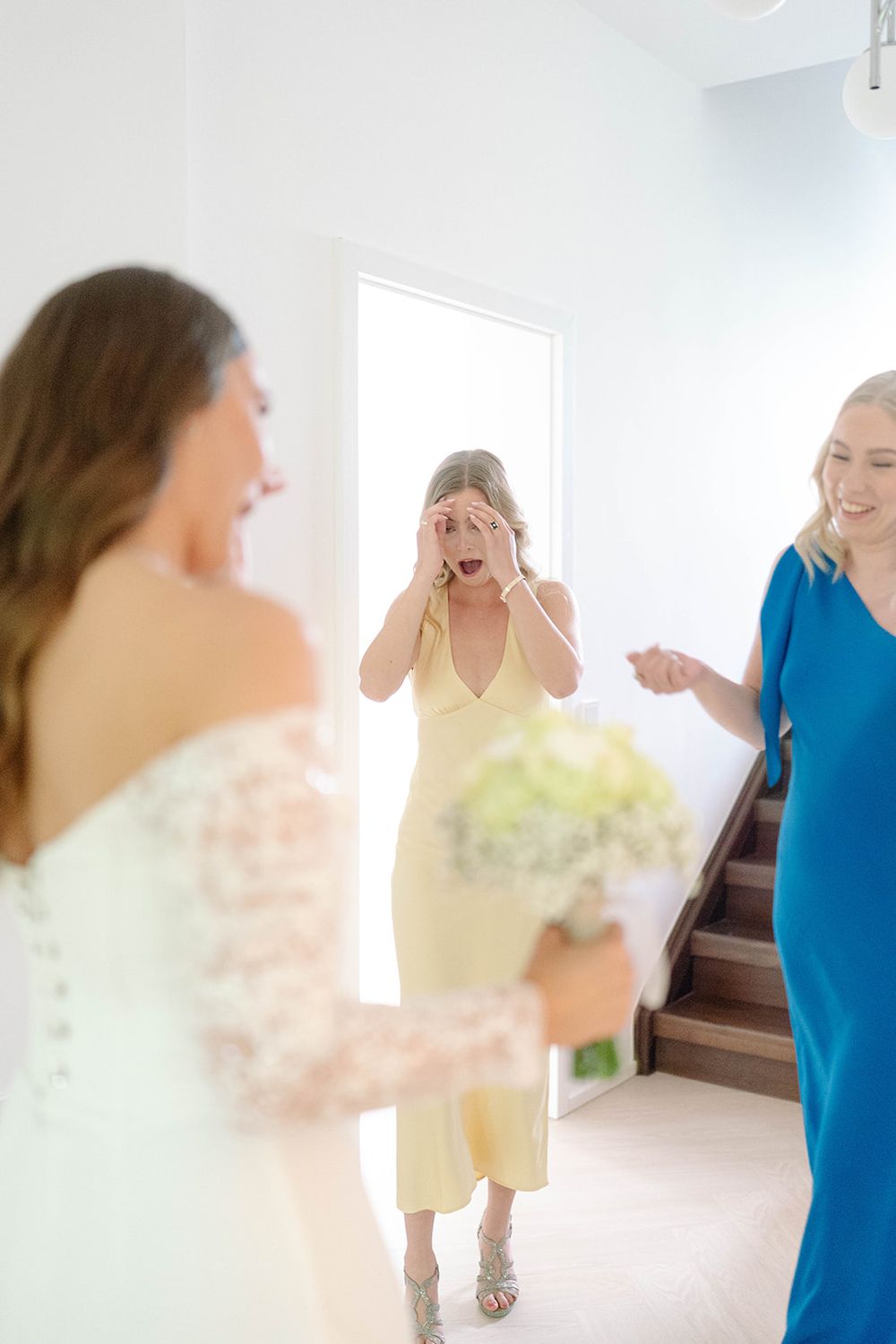 A series of candid moments showing people in formal wear embracing in a bright hallway.