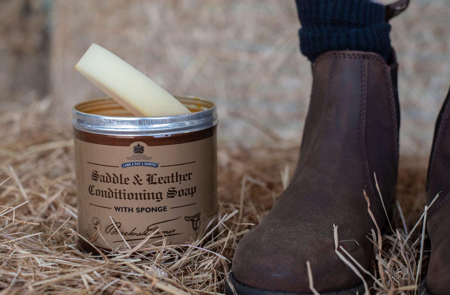 a professional equine brand product photo of saddle soap and brown country boots taken by Jo Rickaston photography in Bedfordshire UK
